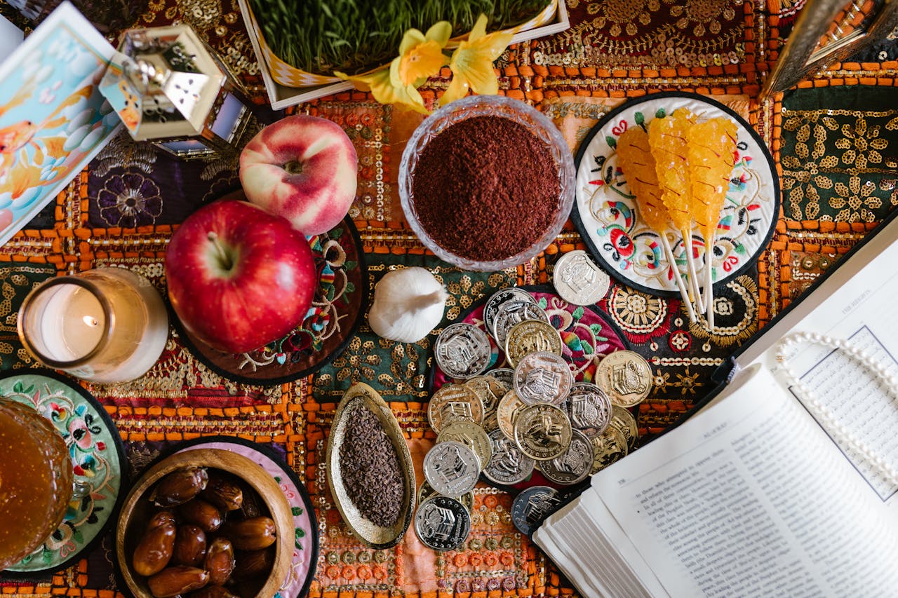 A colorful and festive Nowruz table setting with traditional foods, decorations, and symbols of Persian New Year.
